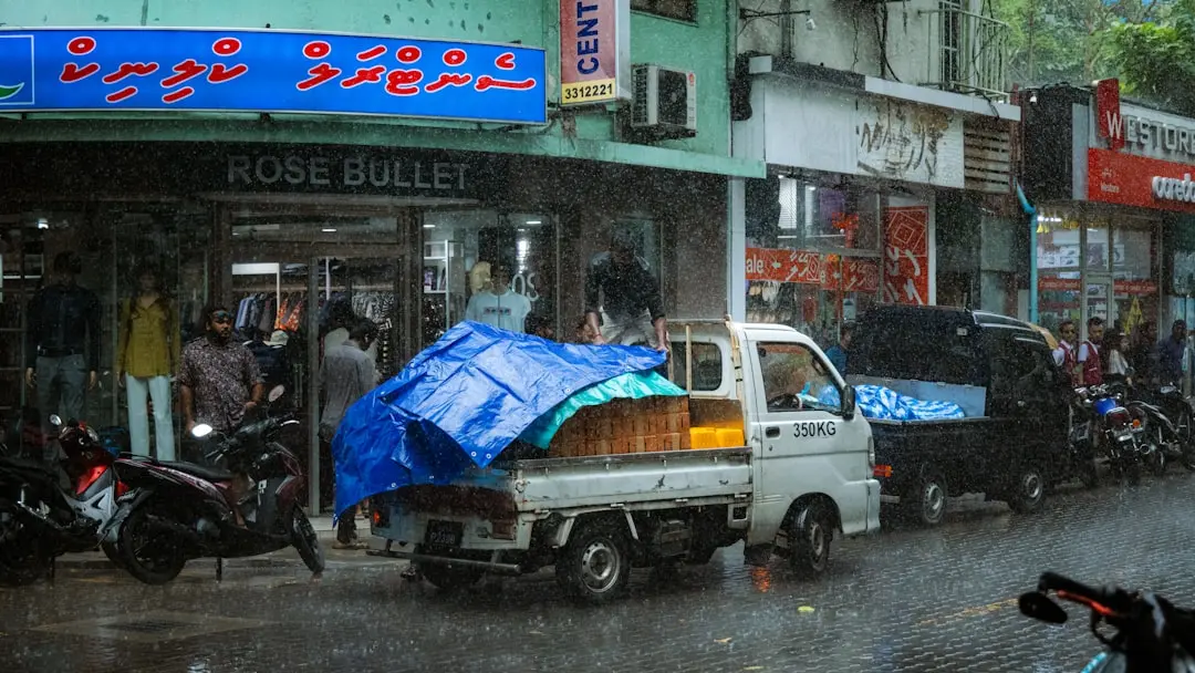 Blue Tarp On Roof Construction Site Rain Protection